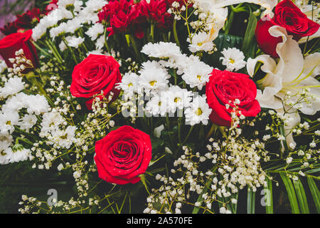 Large Beautiful bouquet of mixed flowers. Floral shop concept . Beautiful fresh cut bouquet. Flowers delivery. red e roses in a bouquet Stock Photo