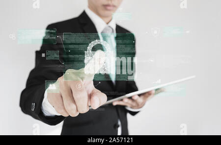 Businessman pressing on digital lock icon on screen. Business data security system technology Stock Photo