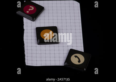 blank checkered sheet with telephone sign on black Stock Photo