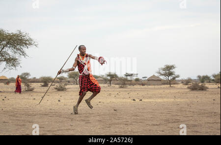 Arusha, Tanzania, 8th September 2019: maasai man throwing a spear Stock Photo