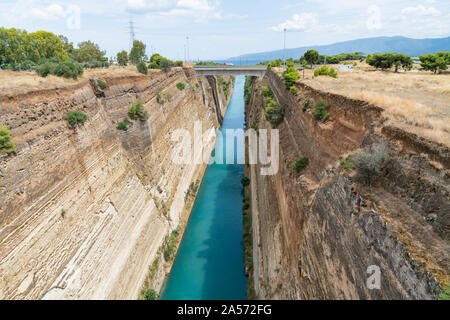 GREECE CORINTH - JULY 17 2019; Corinth Canal with its deep sheer sides connecting the Gulf of Corinth with Saronic Gulf in Aegean Sea. Stock Photo