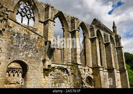 Stone window ruins of Bolton Priory a 12th century Augustinian monastery at Bolton Abbey Wharfedale North Yorkshire England Stock Photo