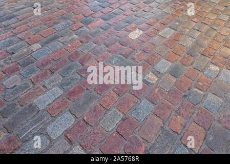 Road completely made of old paving stones Stock Photo