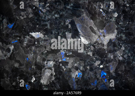 White pattern natural detailed of black marble texture and background for product and interior design. Black granite with blue crystals Stock Photo