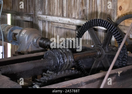 These gears lift the gates, allowing water to flow into a canal bringing it to a electric generating station. Stock Photo