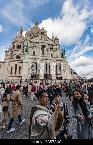 Paris, France - 30th September, 2019:   Sacre Coeur Basilica busy with tourists visiting Paris Stock Photo