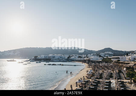 Mykonos, Greece - September 19, 2019: Rows of sunbeds on Platis Gialos beach, a popular beach on the south coast of Mykonos. Stock Photo