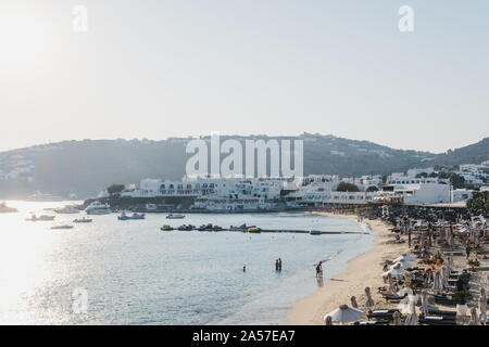 Mykonos, Greece - September 19, 2019: High angle view of people the beach in Platis Gialos, a popular beach on the south coast of Mykonos, on a sunny Stock Photo