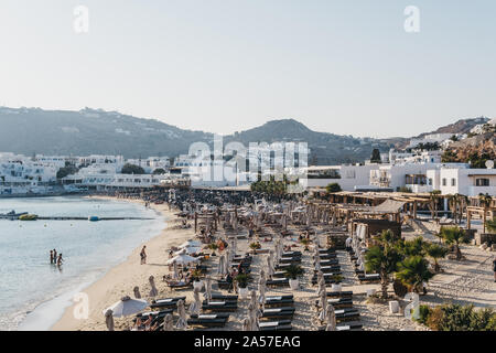 Mykonos, Greece - September 19, 2019: Rows of sunbeds on Platis Gialos beach, a popular beach on the south coast of Mykonos. Stock Photo