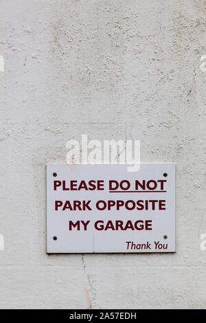 Polite notice requesting no parking Stock Photo