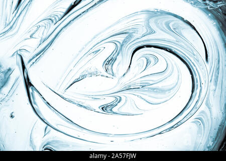Soft abstract background, top view of blue and white swirled paint texture. Stock Photo
