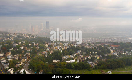 Fog still hangs in the air just after sunrise in Pittsburgh western PA Stock Photo