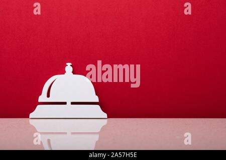 close up of red service bell with ring for a kiss lettering isolated on grey  Stock Photo - Alamy