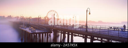Pier with ferris wheel in the background, Santa Monica Pier, Santa Monica, Los Angeles County, California, USA Stock Photo