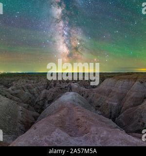 selfy of man standing on badlands in front of the milky way at night Stock Photo