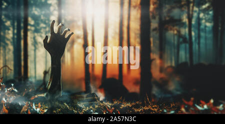 Halloween concept, zombie hand rising out from the ground. 3d rendering Stock Photo