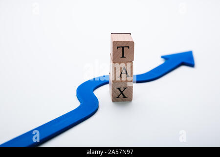 Arrow Going Around Word Tax In Tax Evasion Concept Stock Photo