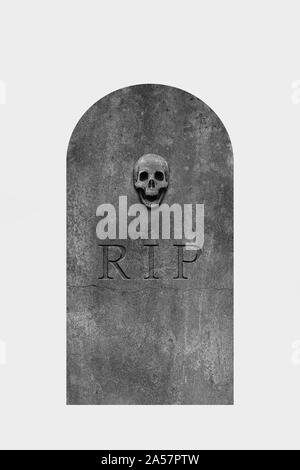 Decorated, oval granite tombstone on white background with engraved R.I.P. text and skull Stock Photo