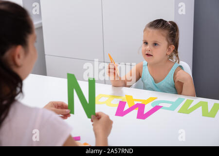 Cute Little Girl At Speech Therapist Office Learning The Letter P Stock Photo