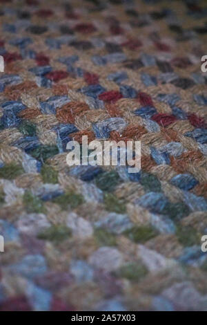 Close up image of a roughly tied seventies multicoloured textured carpet Stock Photo