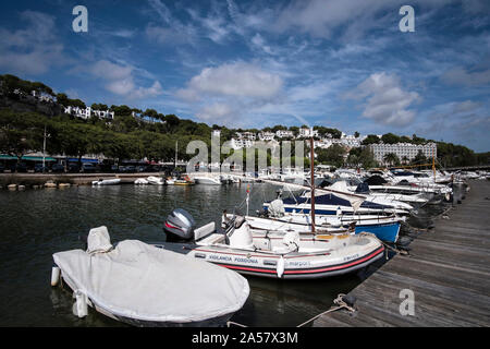 Boats in the harbour in Cala Galdana, Menorca Stock Photo