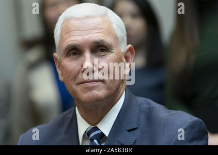 October 18, 2019, Washington, District of Columbia, USA: United States Vice President Mike Pence looks on as US President Donald J. Trump congratulates NASA astronauts Jessica Meir and Christina Koch from the White House in Washington, DC after they conducted the first all-female spacewalk outside of the International Space Station on Friday, October 18, 2019.  .Credit: Chris Kleponis / Pool via CNP (Credit Image: © Chris Kleponis/CNP via ZUMA Wire) Stock Photo