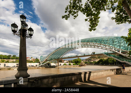 Bridge of Peace and the Mtkvari river. Tbilisi, Georgia. Caucasus Stock Photo