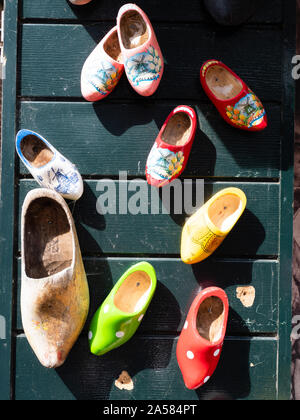 Traditional Dutch wooden clogs hanging on wall, Moonickendam, North Holland, Netherlands Stock Photo