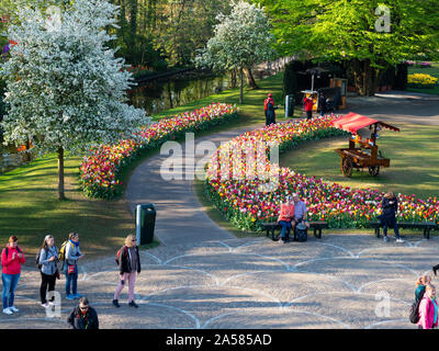 Landscape with tulip flowerbeds along footpath in Keukenhof Gardens, Lisse, South Holland, Netherlands Stock Photo