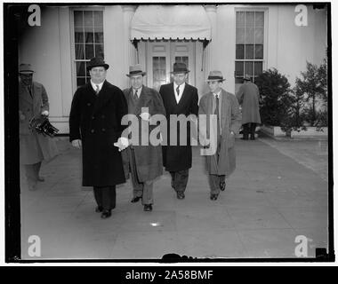 UAWU leaders urge President to appropriate $130,000,000 for Michigan relief. Washington, D.C., Feb. 1. Led by Homer Martin, President, representatives of the United Automobile Workers Union called at the White House today and urged President Roosevelt to appropriate $130,000,000 for Michigan relief to avoid mass starvation and mass misery. They also left with the President their recommendations and a statement on employment, unemployment and average wage of workers in the auto industry. Left to right: Richard T. Frankensteen, Vice President Stock Photo