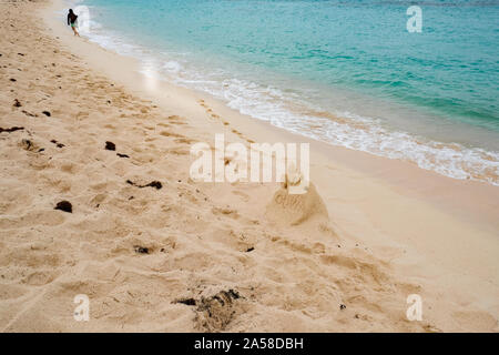 Walking on Horseshoe Bay beach in Bermuda. Stock Photo