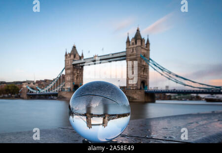 The iconic landmark of Tower Bridge seen through a crystal ball. Stock Photo
