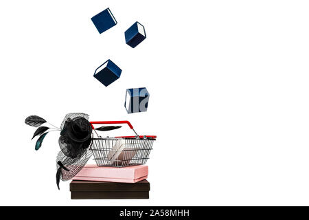 Close-up shopping basket with female hat with veil and feather in retro style and flying falling gift boxes white background. Black Friday and Thanksgiving Christmas shopping sale concept. Vintage Stock Photo