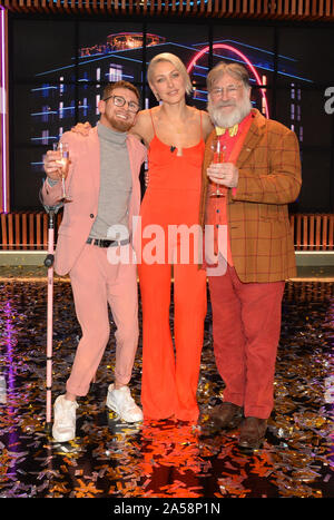(left to right) Winner Paddy Smyth, host Emma Willis and Viewer's Champion Tim Wilson celebrate after the final of the second series of Channel 4's The Circle in Salford, Manchester. Stock Photo