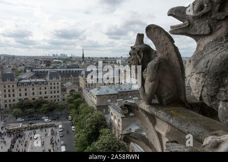 Gargoyles on roof of Notre Dame cathedral with Eiffel Tower on horizon Stock Photo