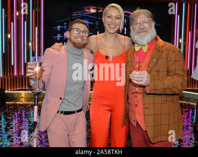(left to right) Winner Paddy Smyth, host Emma Willis and Viewer's Champion Tim Wilson celebrate after the final of the second series of Channel 4's The Circle in Salford, Manchester. Stock Photo