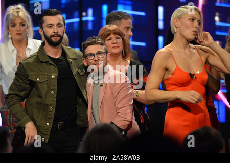 (left to right) Finalist James Doran, winner Paddy Smyth and host Emma Willis during the final of the second series of Channel 4's The Circle in Salford, Manchester. PA Photo. Picture date: Friday October 18, 2019. See PA story SHOWBIZ Circle. Photo credit should read: Peter Powell/PA Wire Stock Photo