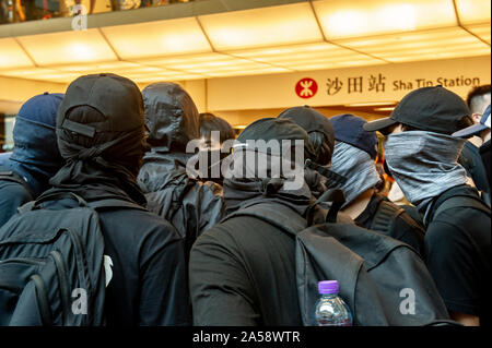 Crowds of protestors in a shopping Mall in Hong Kong gather before attacking and destroying the interior of the mall Stock Photo