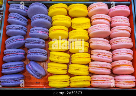 Colorful macaroon cakes in tray for sale at bakery  Stock Photo