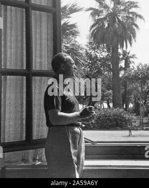 Eva Braun Collection (album 4) - Distinguished man standing on patio looking right ca. late 1930s Stock Photo