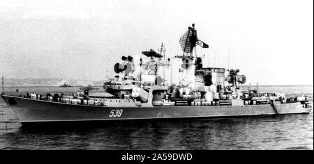 1977 - A port beam view of an anchored Soviet Kara class cruiser. Stock Photo