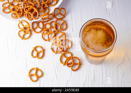 Top view of a Beer and pretzels on a white background Stock Photo