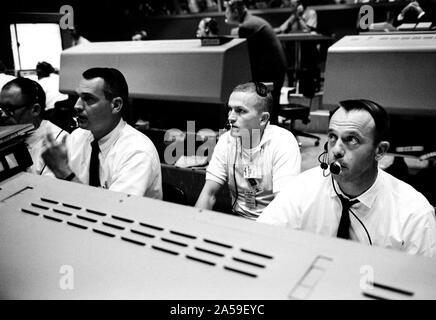 (3 June 1965) --- Shown at their consoles during the liftoff of Gemini-4 (from left) are astronauts Clifford C. Williams Jr., Frank Borman and Alan B. Shepard Jr. Borman was command pilot of the backup crew for the Gemini-4 flight. The three astronauts monitored the flight from the Mission Control Center at Cape Kennedy. Stock Photo