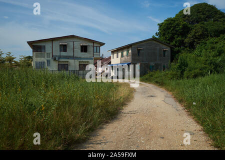 A cluster of old, traditional, wood houses in a Kampung, village, in the town of Pekan. In Pahang, Malaysia. Stock Photo