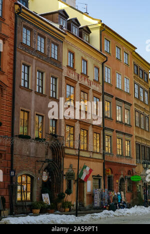 Warsaw, Poland -January 5, 2011: Houses in old town market square, Warsaw, Poland. Winter time with snow Stock Photo