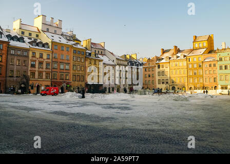 Warsaw, Poland -January 5, 2011: Houses in old town market square, Warsaw, Poland. Winter time with snow Stock Photo