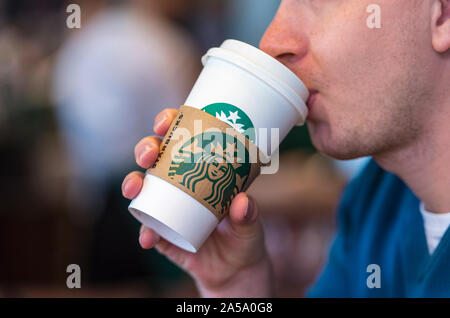 NEW - YORK - MAY 06: Man drinking beverage at the Starbucks cafe in New-York on May 06. 2017 in The USA Stock Photo