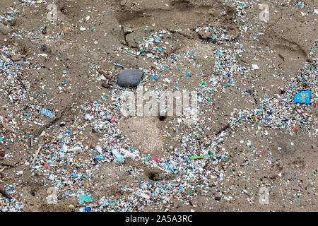 Thousands and thousand of bits of plastic mark the high water mark on this Northshore beach. Much of the north side of the island of Maui in inaccessi Stock Photo