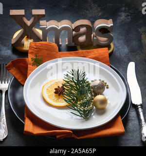 Christmas table setting. Holiday Decorations on black background. Stock Photo
