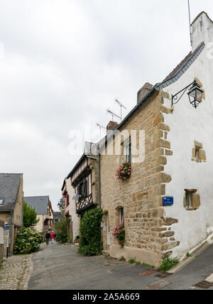 Auray, Morbihan / France - 25 August 2019: older couple walks through the narrow streets of an idyllic French village Stock Photo